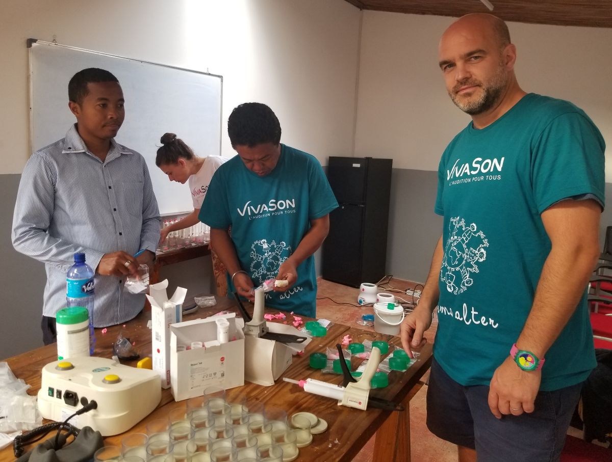 Vivason volunteers creating a hearing aid mold